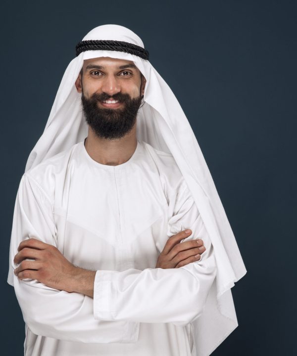 Arabian saudi businessman on dark blue studio background